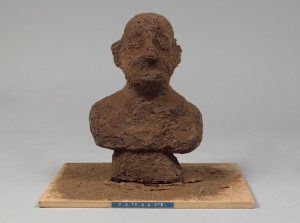 Dieter Roth. P.O.TH.A.A.VFB (Portrait of the artist as a Vogelfutterbüste [birdseed bust]). 1968. Multiple of chocolate and birdseed, overall: 8 1/4 x 5 1/2 x 4 3/4″ (21 x 14 x 12 cm). Publisher: Harke Verlag, Cologne. Fabricator: Rudolf Rieser, Cologne. Edition: 30. The Museum of Modern Art, New York. Sue and Edgar Wachenheim III Endowment Fund and acquired through the generosity of Peter H. Friedland. Photograph: John Wronn. © 2013 Estate of Dieter Roth